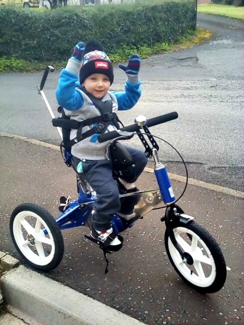 Charlie is delighted with his new Tomcat Tiger Trike