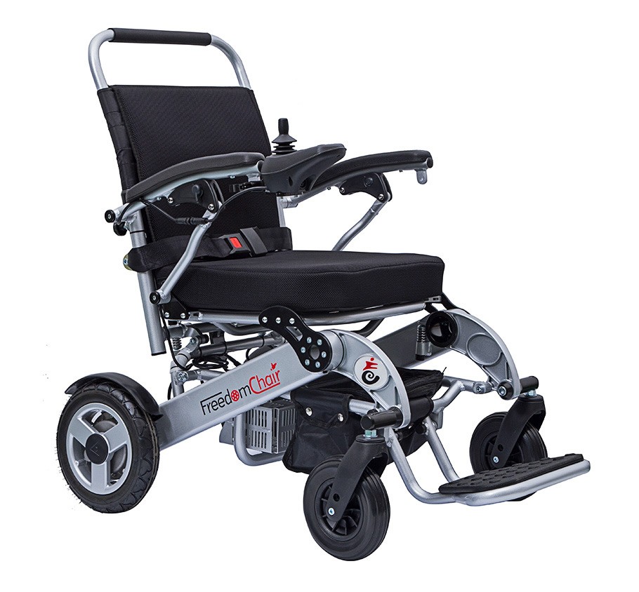 Folding electric wheelchair with attendant controls